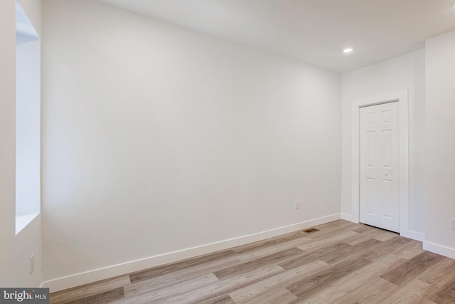 spare room featuring light hardwood / wood-style floors