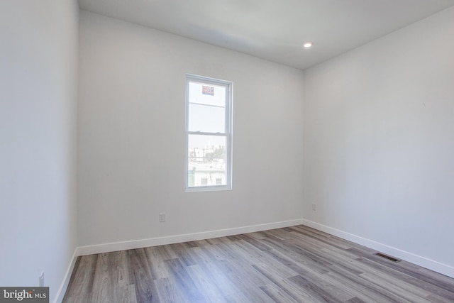 empty room with light hardwood / wood-style floors