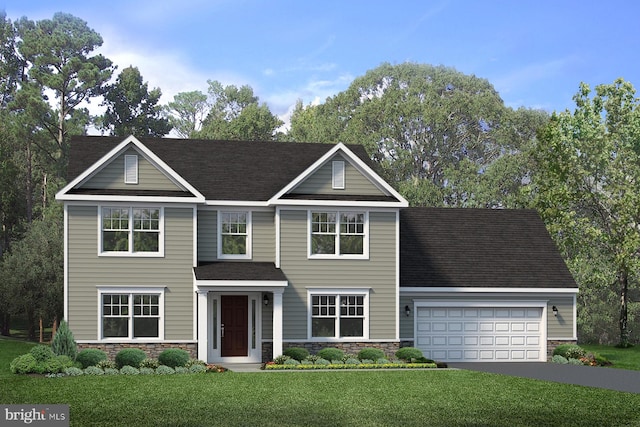 view of front of property with a garage and a front lawn