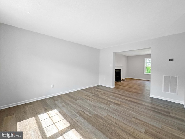 unfurnished living room with hardwood / wood-style floors