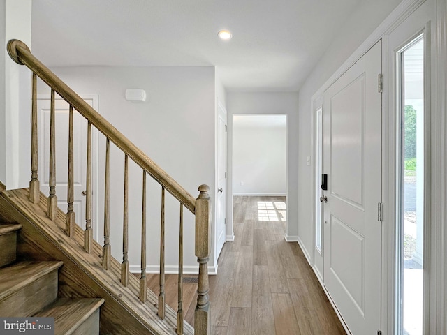 foyer entrance with hardwood / wood-style floors