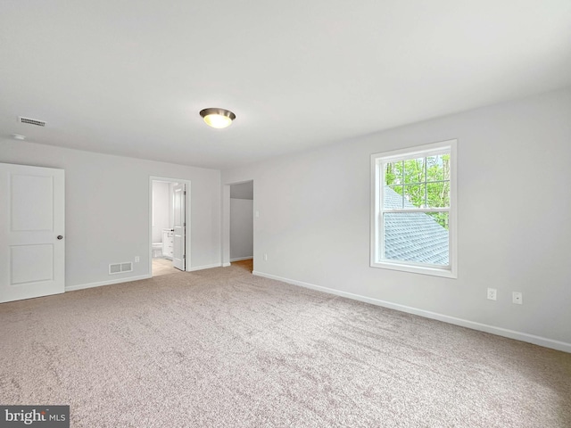 empty room with light colored carpet