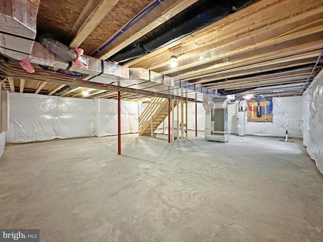 basement with heating unit and water heater