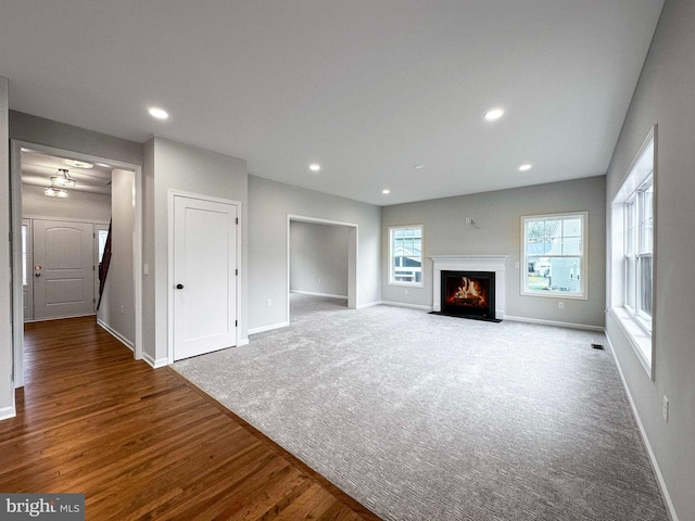 unfurnished living room featuring hardwood / wood-style flooring