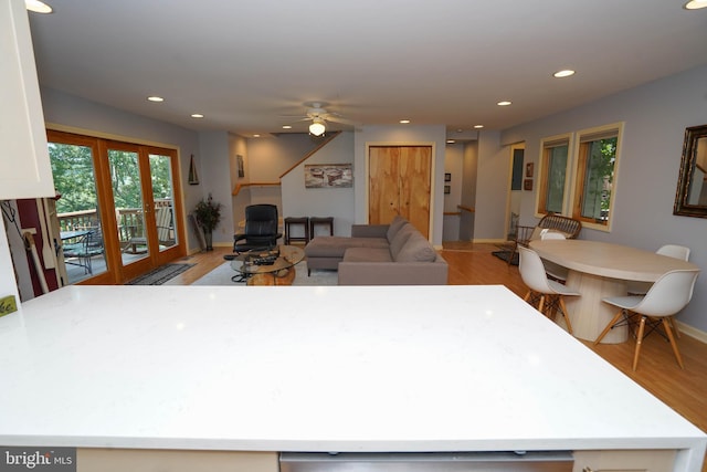 kitchen with open floor plan, light countertops, light wood-style floors, and recessed lighting