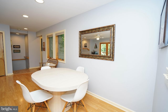 tiled dining area with ceiling fan