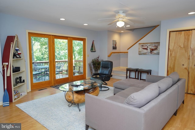 living area with light wood finished floors, ceiling fan, visible vents, and recessed lighting