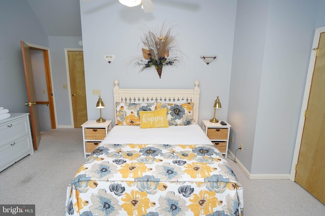 bedroom featuring light carpet, ceiling fan, and baseboards