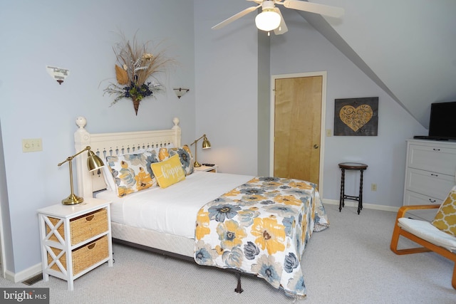 bedroom featuring baseboards, vaulted ceiling, a ceiling fan, and light colored carpet