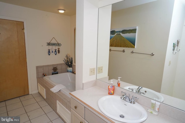 bathroom with tile patterned flooring, vanity, and a bath