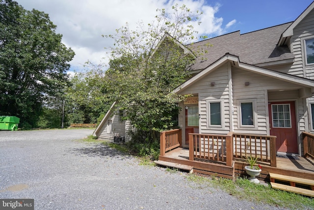 view of home's exterior with a wooden deck