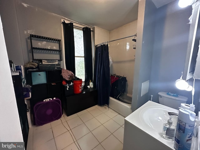 full bathroom with toilet, tile floors, shower / bath combination with curtain, and sink