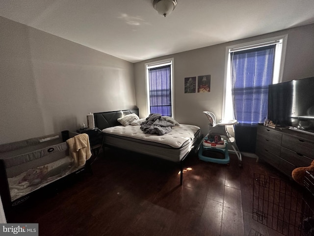 bedroom featuring dark wood-type flooring