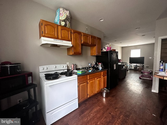 kitchen featuring black fridge, dark hardwood / wood-style floors, and white electric range