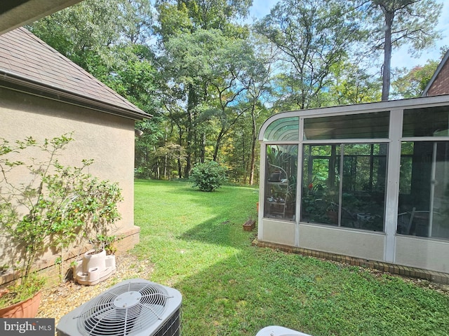 view of yard featuring central AC