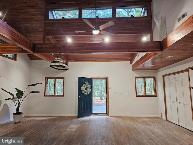 entrance foyer with high vaulted ceiling, wood ceiling, ceiling fan, and wood-type flooring