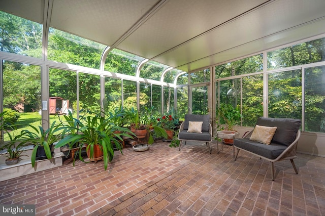 unfurnished sunroom with plenty of natural light