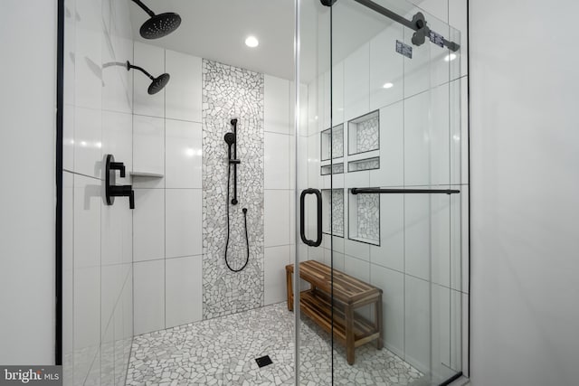 bathroom with a shower with shower door