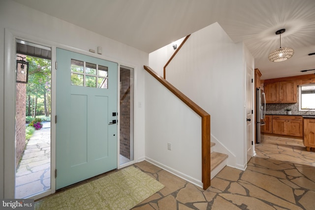 entrance foyer with a notable chandelier