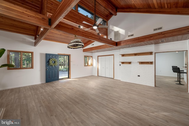 empty room featuring ceiling fan, light hardwood / wood-style flooring, beam ceiling, and wood ceiling