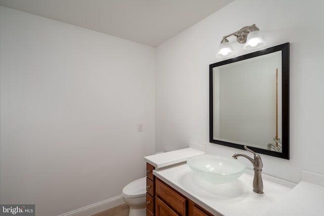 bathroom with oversized vanity and toilet