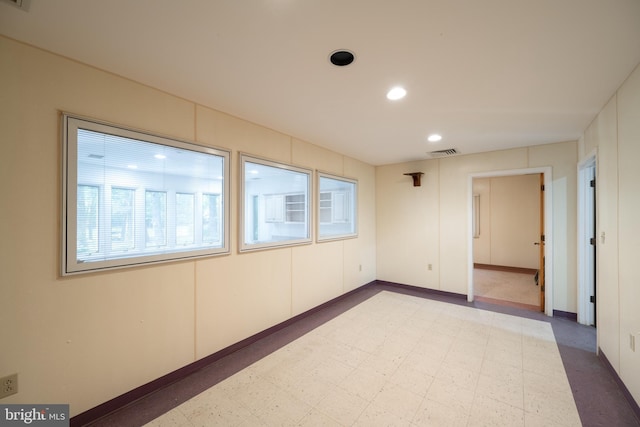 empty room with light tile floors