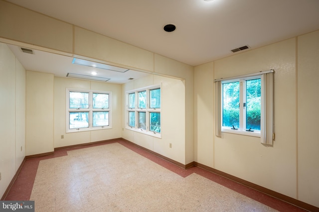 spare room featuring a wealth of natural light