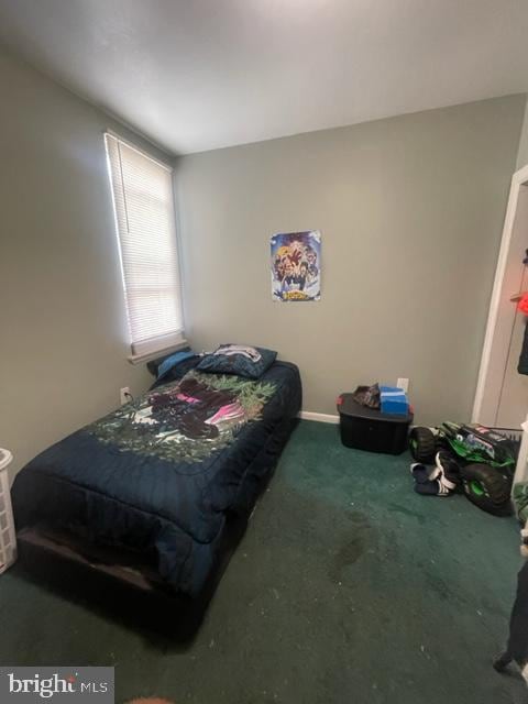 bedroom with dark carpet