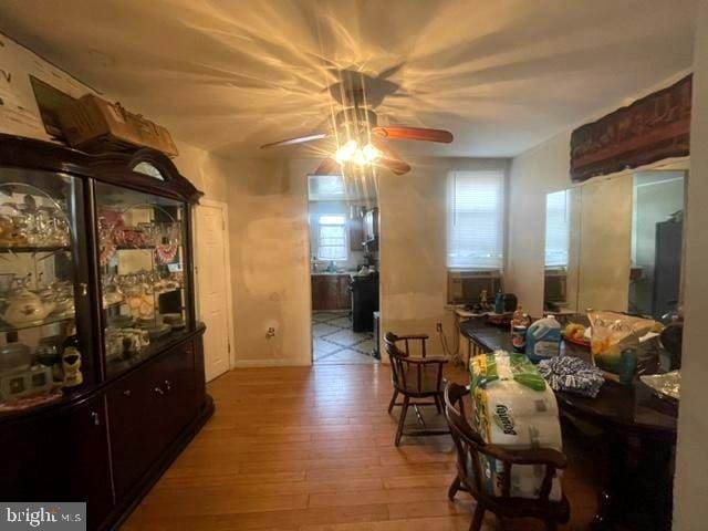 dining space featuring light hardwood / wood-style floors and ceiling fan