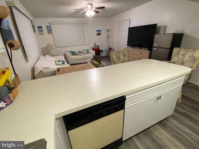 kitchen featuring wood-type flooring, ceiling fan, and white dishwasher