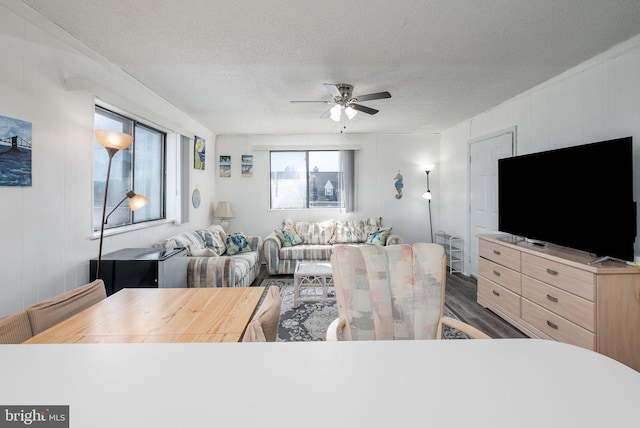 14311 Tunnel Ave Unit 304, Ocean City, MD 21842 - living area featuring ceiling fan, wood finished floors, and a textured ceiling