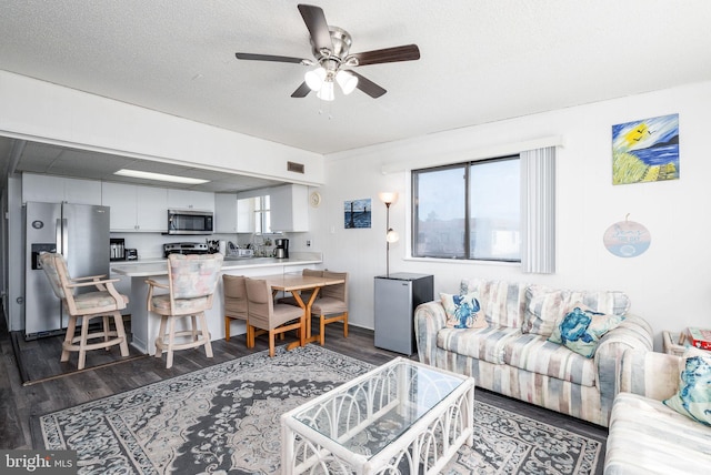 14311 Tunnel Ave Unit 304, Ocean City, MD 21842 - living room featuring a ceiling fan, dark wood-style flooring, and visible vents
