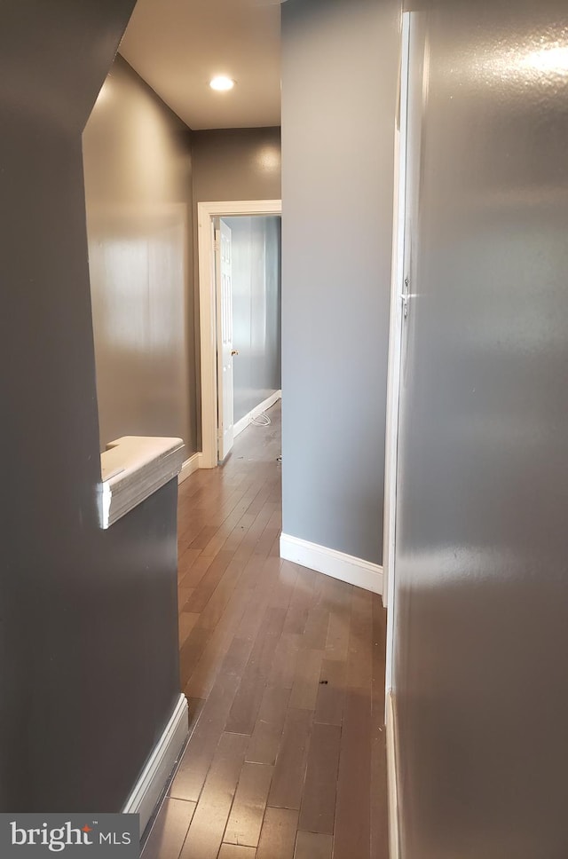 hallway featuring dark hardwood / wood-style floors