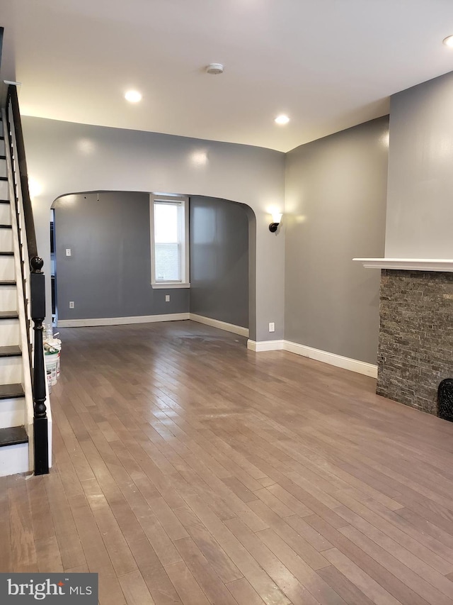 unfurnished living room with hardwood / wood-style flooring