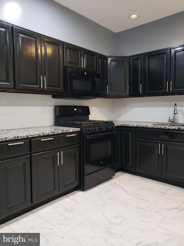 kitchen with light tile flooring, sink, light stone countertops, and black appliances