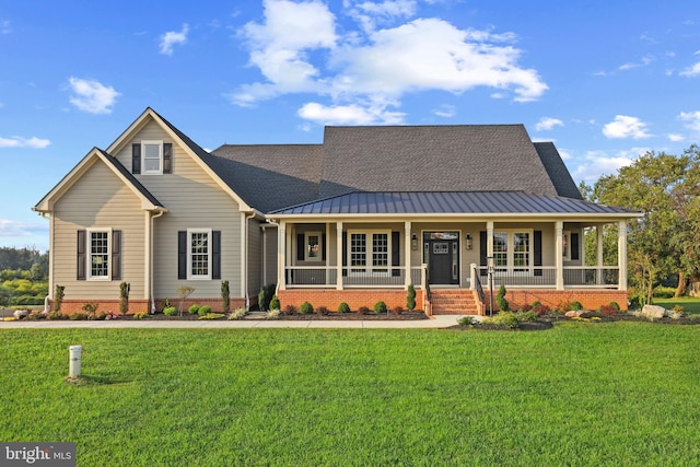 view of front facade featuring a front yard and a porch