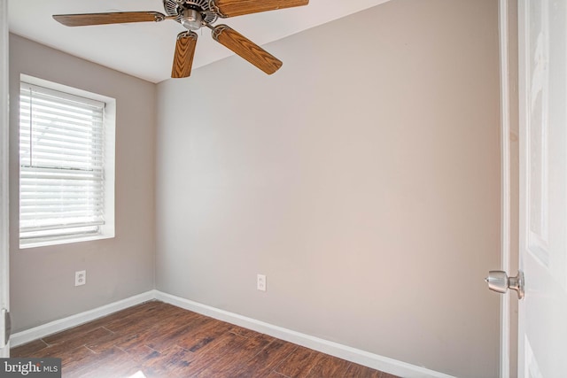 unfurnished room featuring dark wood-type flooring and ceiling fan