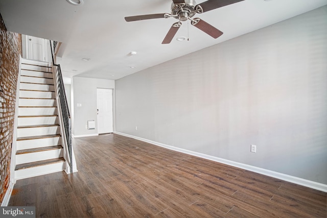 spare room with ceiling fan and dark wood-type flooring