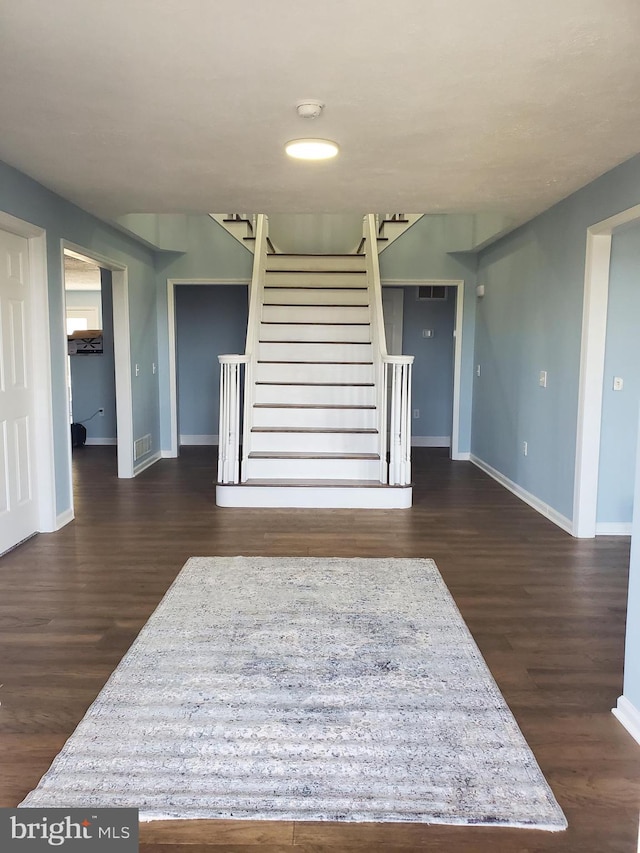 interior space with dark hardwood / wood-style flooring