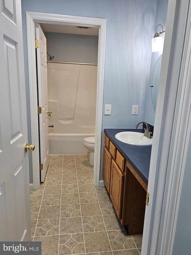 full bathroom featuring bathing tub / shower combination, tile flooring, toilet, and vanity