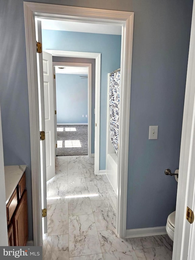 full bathroom featuring toilet, shower / bathtub combination with curtain, tile flooring, and vanity