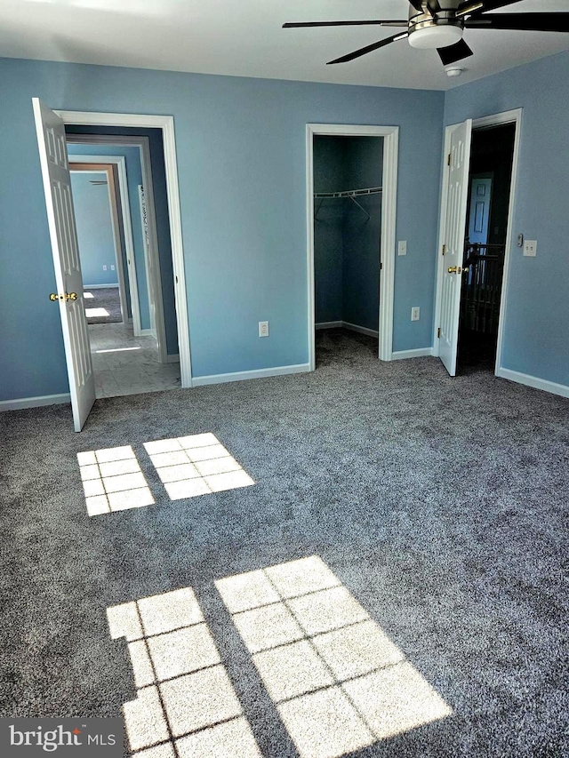 unfurnished bedroom featuring a closet, ceiling fan, and carpet floors