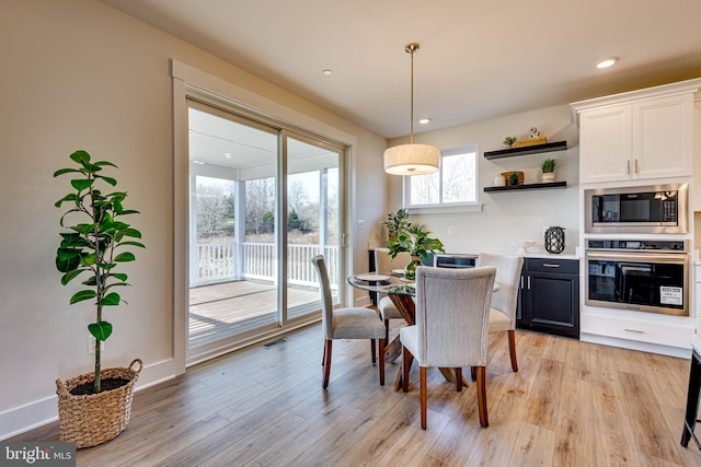 dining room featuring light wood-type flooring