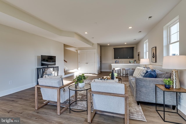 living room with dark hardwood / wood-style floors