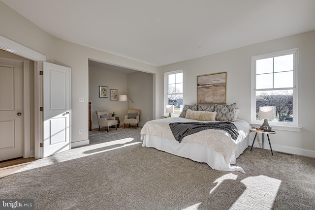 bedroom featuring light carpet