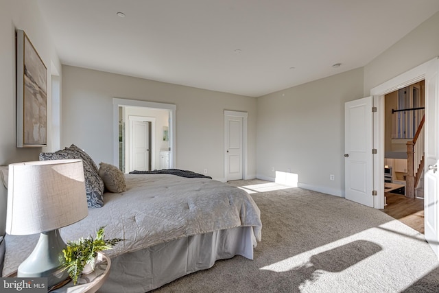 carpeted bedroom featuring connected bathroom