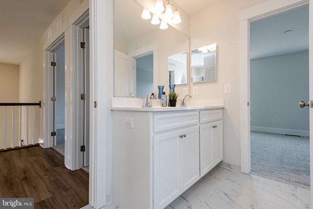 bathroom with double sink vanity and tile flooring