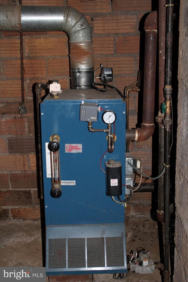 utility room featuring heating utilities