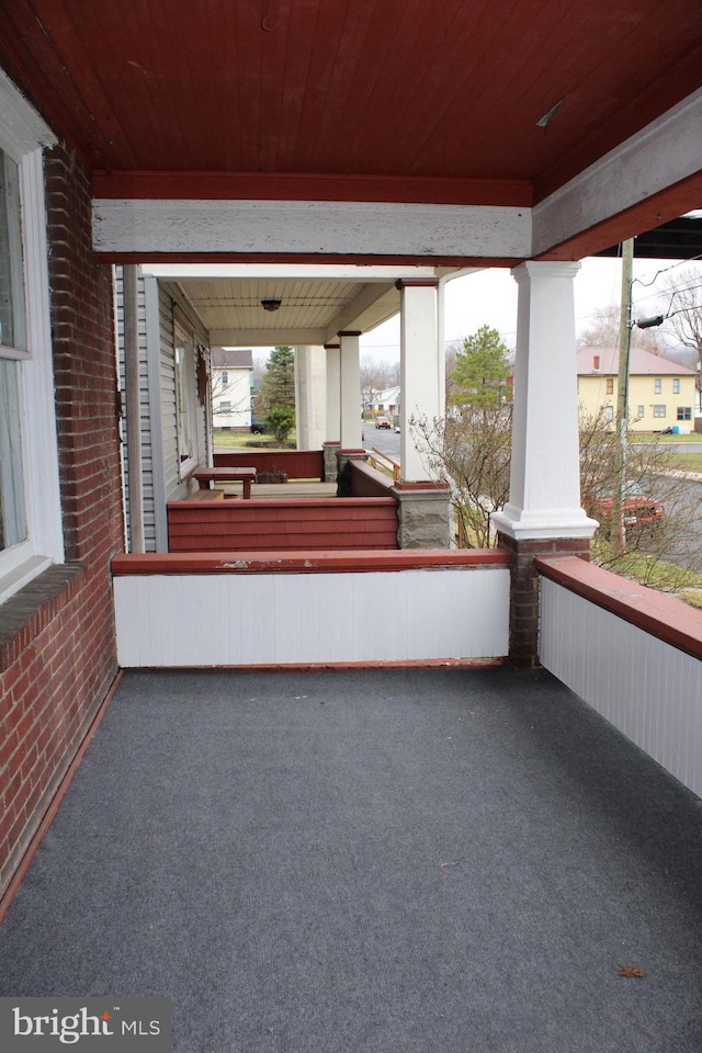 unfurnished sunroom featuring wood ceiling