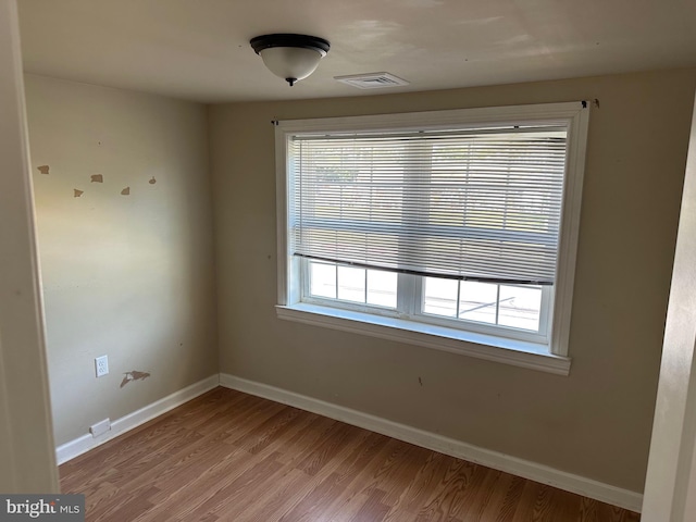 empty room with light wood-type flooring